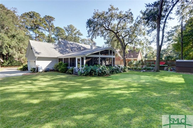 8 Baker Dr, Savannah, GA 31410 - exterior space with fence, a sunroom, driveway, and a garage