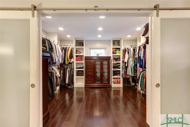 8 Baker Dr, Savannah, GA 31410 - walk in closet featuring a barn door and wood finished floors