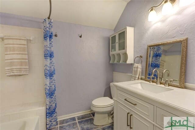 8 Baker Dr, Savannah, GA 31410 - bathroom with vanity, tile patterned floors, vaulted ceiling, and toilet