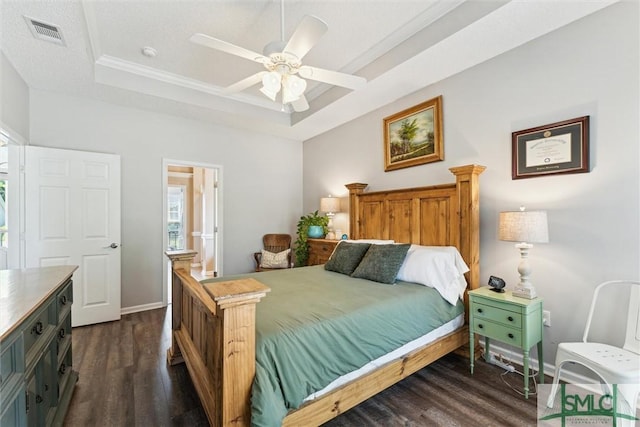 125 Blue Lake St, Richmond Hill, GA 31324 - bedroom featuring a tray ceiling, crown molding, dark wood finished floors, visible vents, and baseboards