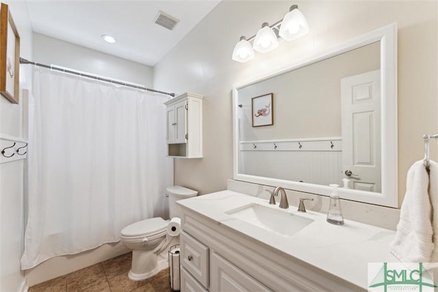 bathroom featuring tile patterned floors, shower / bath combo, toilet, vanity, and visible vents
