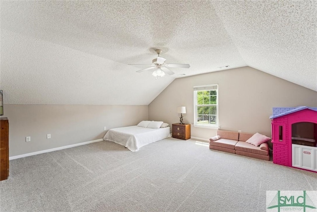 carpeted bedroom featuring lofted ceiling, a textured ceiling, a ceiling fan, and baseboards