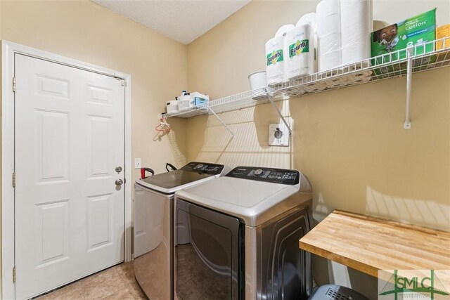 125 Blue Lake St, Richmond Hill, GA 31324 - laundry area featuring laundry area, light tile patterned floors, and washing machine and clothes dryer