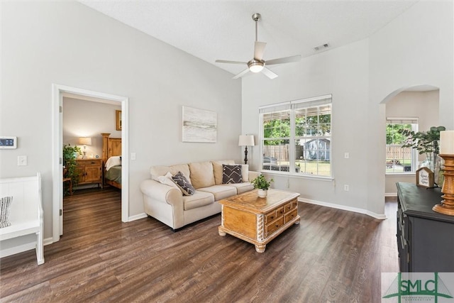 125 Blue Lake St, Richmond Hill, GA 31324 - living area with a high ceiling, arched walkways, dark wood-style floors, and a ceiling fan