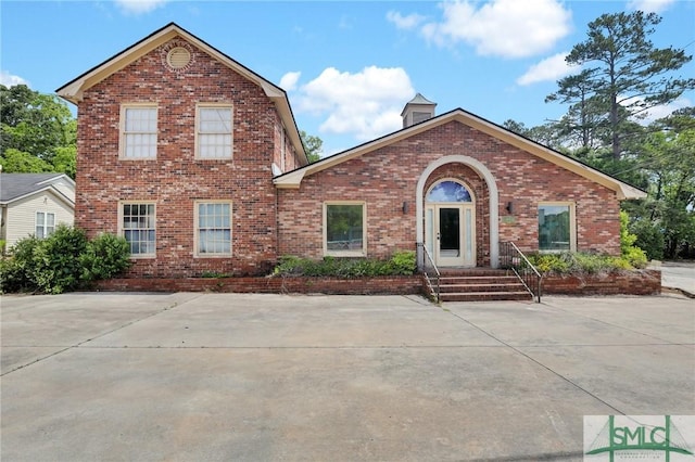 traditional home with brick siding