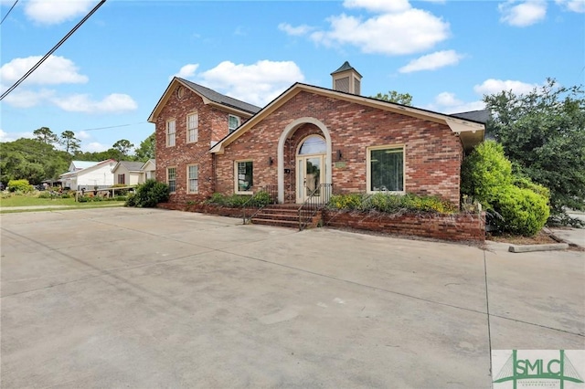 traditional-style house with brick siding