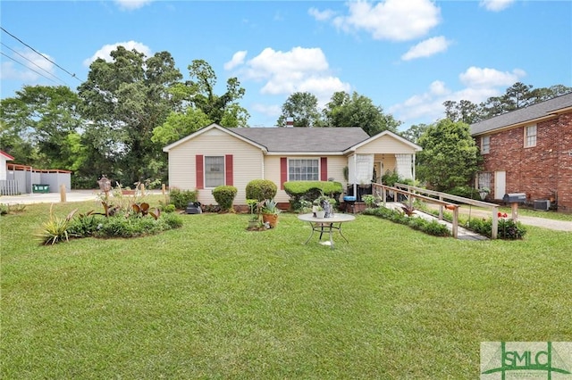 ranch-style home featuring a front lawn