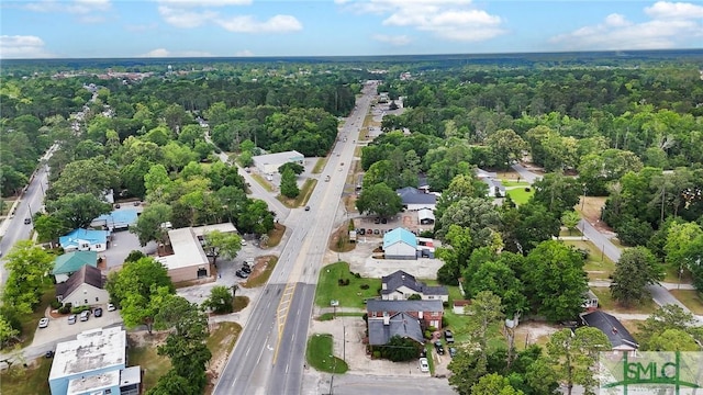 bird's eye view featuring a residential view and a forest view