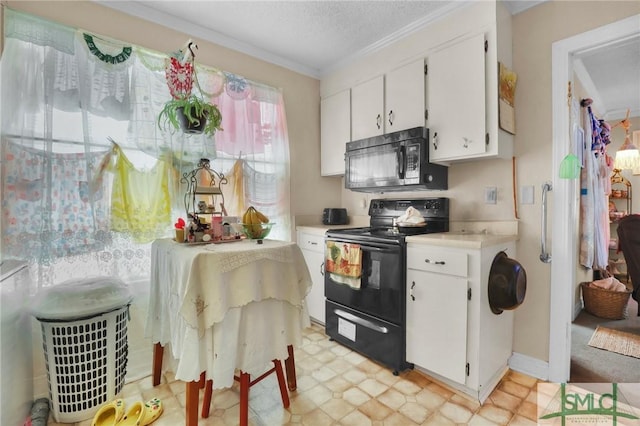 kitchen with crown molding, white cabinets, light countertops, black appliances, and light floors