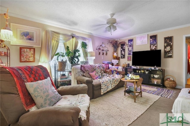 living room with a textured ceiling, ceiling fan, ornamental molding, and carpet floors