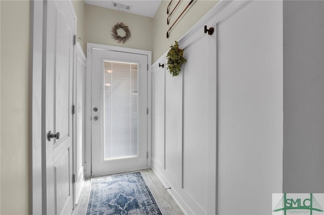 doorway with visible vents and light wood-style floors