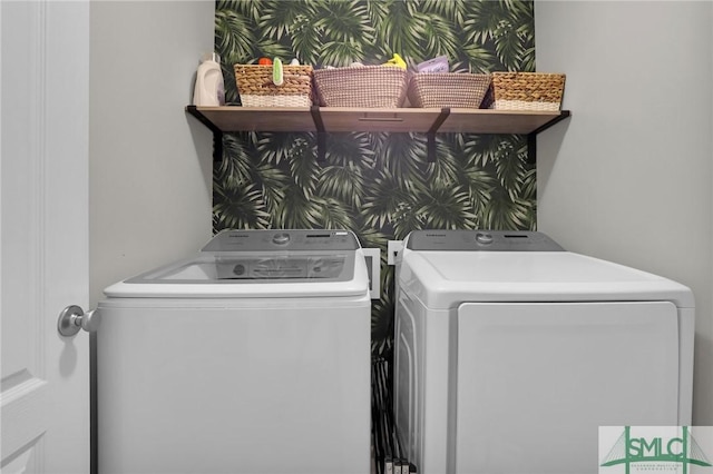 clothes washing area featuring laundry area and washing machine and dryer