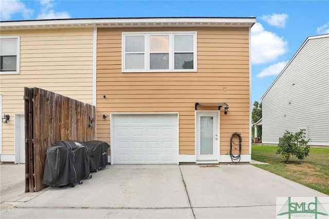 view of front of property with driveway and an attached garage