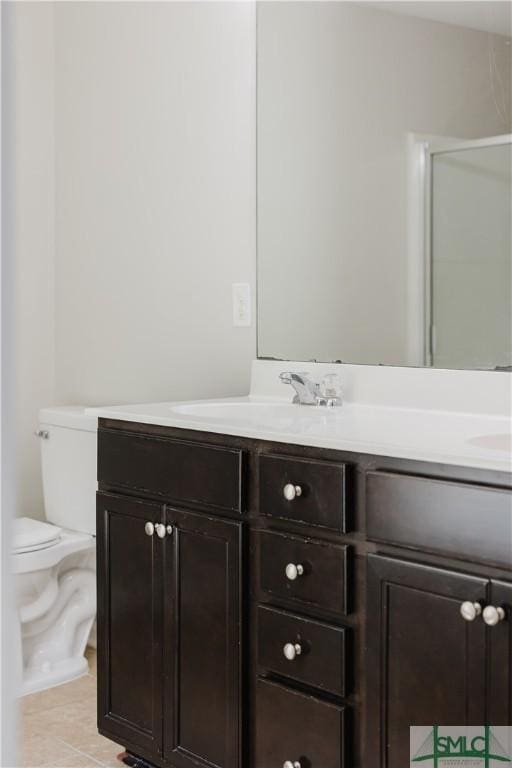 154 Hamilton Grove Dr, Pooler, GA 31322 - full bath featuring double vanity, toilet, tile patterned floors, a sink, and a shower with shower door
