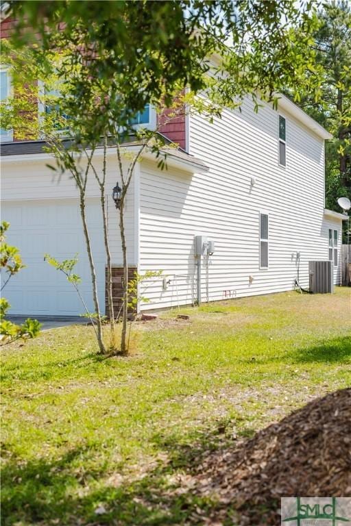 154 Hamilton Grove Dr, Pooler, GA 31322 - view of property exterior featuring a yard, central AC, and a garage
