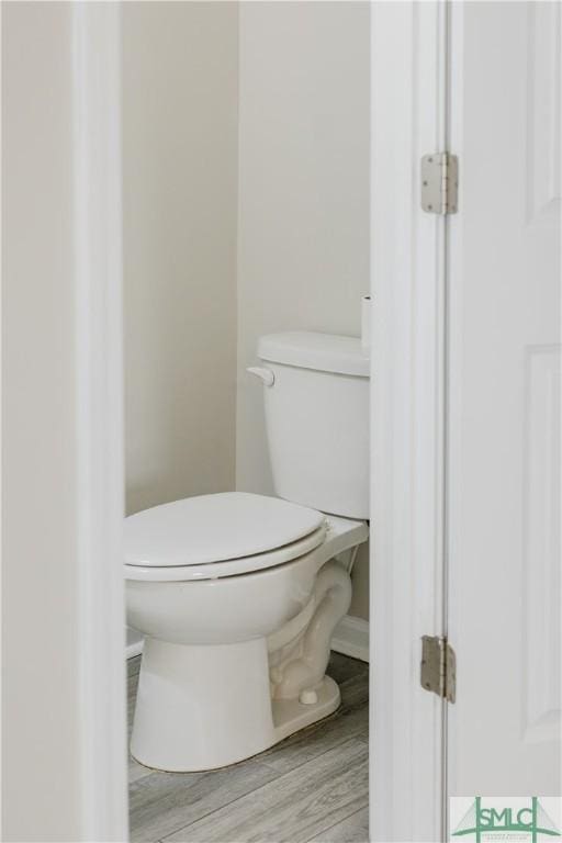 154 Hamilton Grove Dr, Pooler, GA 31322 - bathroom featuring baseboards, wood finished floors, and toilet