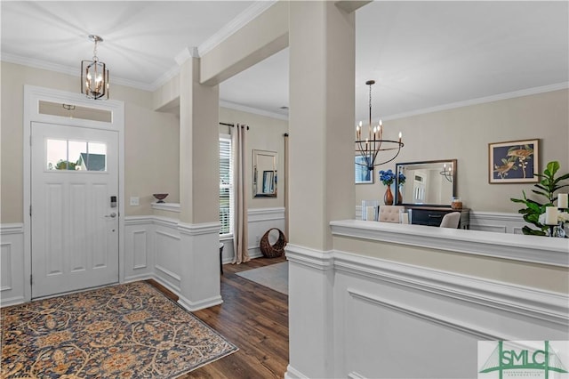 21 Shoefstall St, Savannah, GA 31407 - foyer featuring ornamental molding, wainscoting, a notable chandelier, and dark wood-style floors