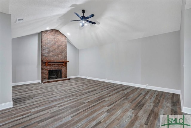 4 Quail Trl, Savannah, GA 31406 - unfurnished living room with a ceiling fan, a fireplace, vaulted ceiling, wood finished floors, and baseboards