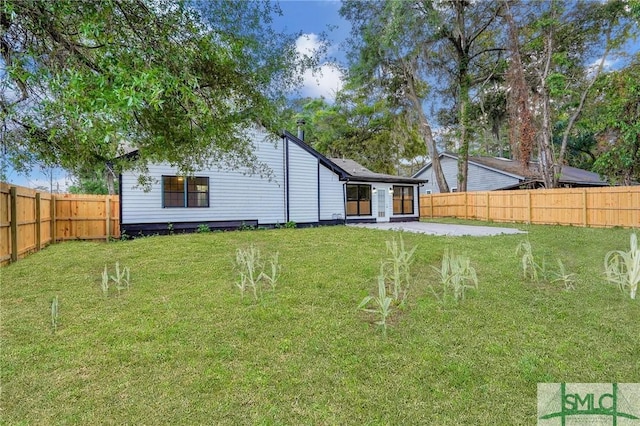 4 Quail Trl, Savannah, GA 31406 - rear view of property with a lawn, a fenced backyard, and a patio area