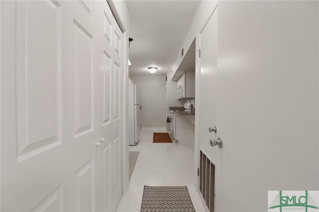 401 N Cromwell Rd Unit P-5, Savannah, GA 31410 - hall featuring a textured ceiling and visible vents
