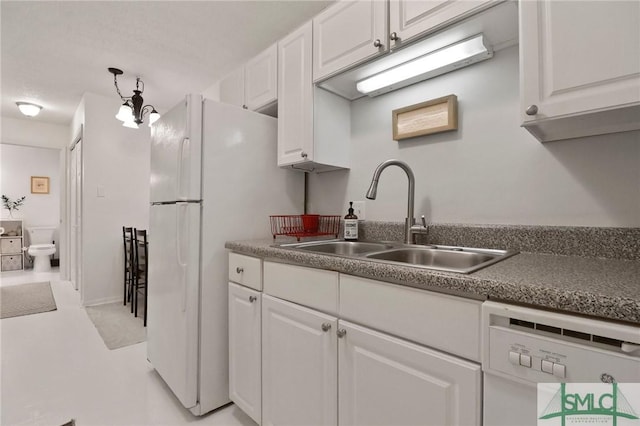 401 N Cromwell Rd Unit P-5, Savannah, GA 31410 - kitchen featuring a sink, white cabinetry, and white appliances