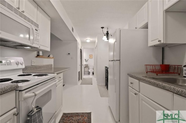 401 N Cromwell Rd Unit P-5, Savannah, GA 31410 - kitchen featuring a sink, white cabinets, and white appliances
