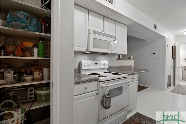 401 N Cromwell Rd Unit P-5, Savannah, GA 31410 - kitchen with white cabinets, white appliances, and visible vents