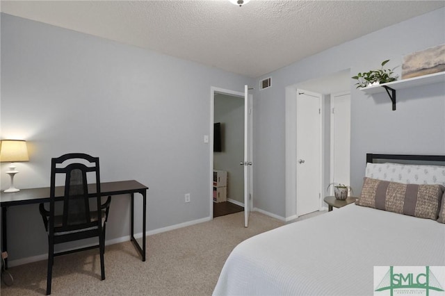 401 N Cromwell Rd Unit P-5, Savannah, GA 31410 - carpeted bedroom with visible vents, a textured ceiling, and baseboards