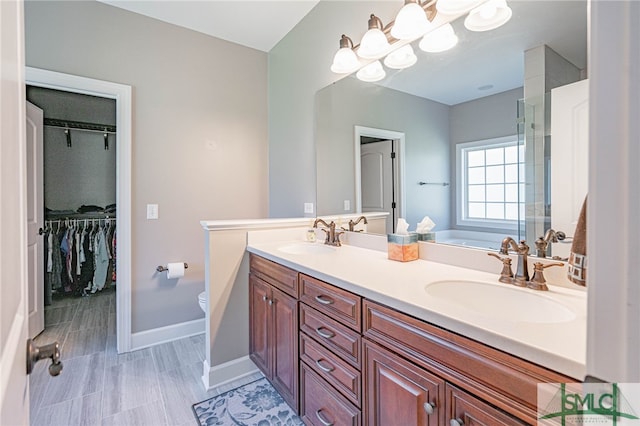 23 Olde Gate Ct, Pooler, GA 31322 - bathroom featuring a sink, toilet, double vanity, and a spacious closet