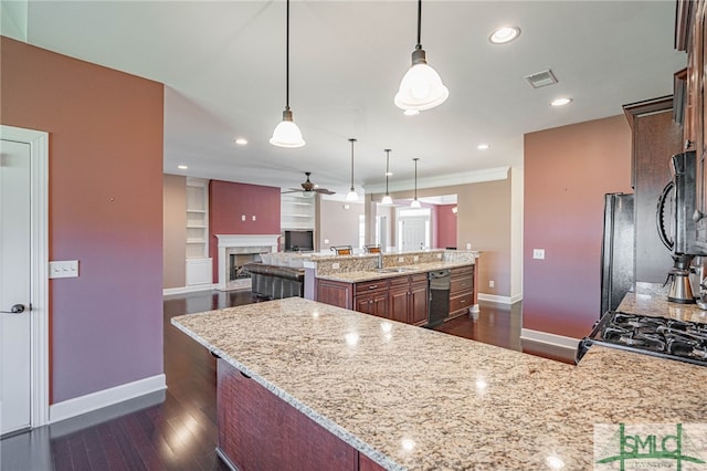 23 Olde Gate Ct, Pooler, GA 31322 - kitchen with a ceiling fan, black appliances, dark wood-style flooring, baseboards, and light stone counters