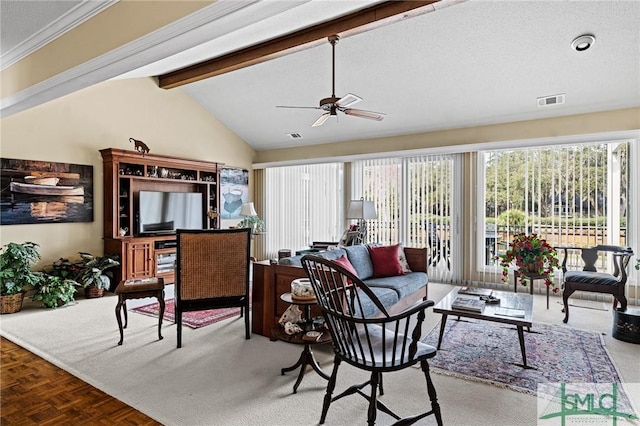 living area with visible vents, ceiling fan, and vaulted ceiling with beams