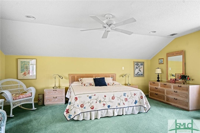bedroom featuring ceiling fan, carpet flooring, visible vents, and lofted ceiling