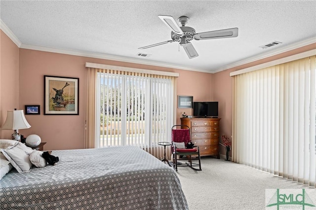 bedroom with crown molding, carpet, a ceiling fan, and visible vents