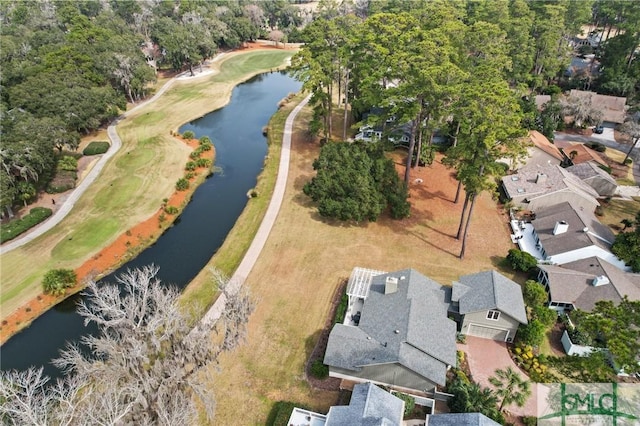 birds eye view of property with a residential view, a water view, and golf course view