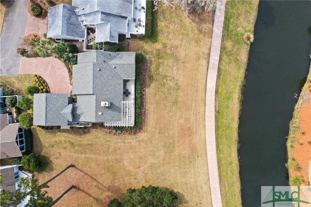 bird's eye view with a water view