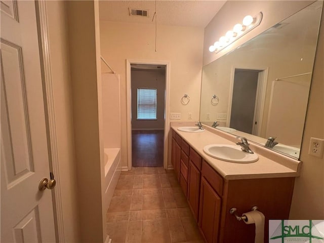 13 Copper Ct, Savannah, GA 31419 - bathroom with double vanity, visible vents, and a sink