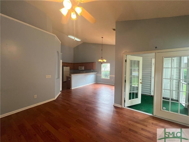 13 Copper Ct, Savannah, GA 31419 - interior space with dark wood-style flooring, high vaulted ceiling, french doors, ceiling fan with notable chandelier, and baseboards