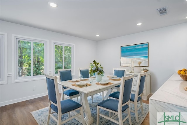 dining area featuring baseboards, recessed lighting, wood finished floors, and visible vents