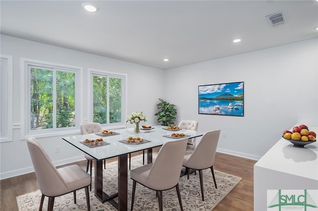 dining area featuring visible vents, recessed lighting, baseboards, and wood finished floors