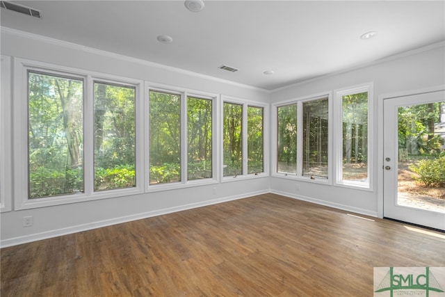 unfurnished sunroom with visible vents, ornamental molding, and baseboards