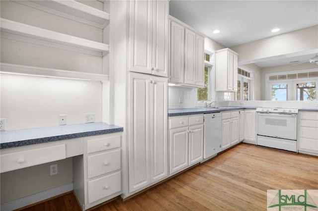 kitchen with recessed lighting, white cabinetry, light wood finished floors, and white appliances
