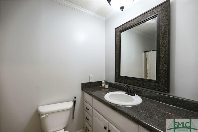 full bathroom with crown molding, toilet, and vanity