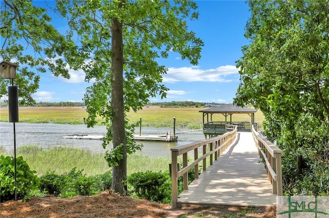 dock area with a water view and a gazebo