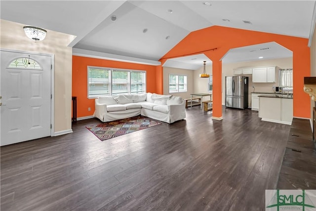 2115 Gable St, Savannah, GA 31404 - living room with baseboards, vaulted ceiling, and dark wood finished floors
