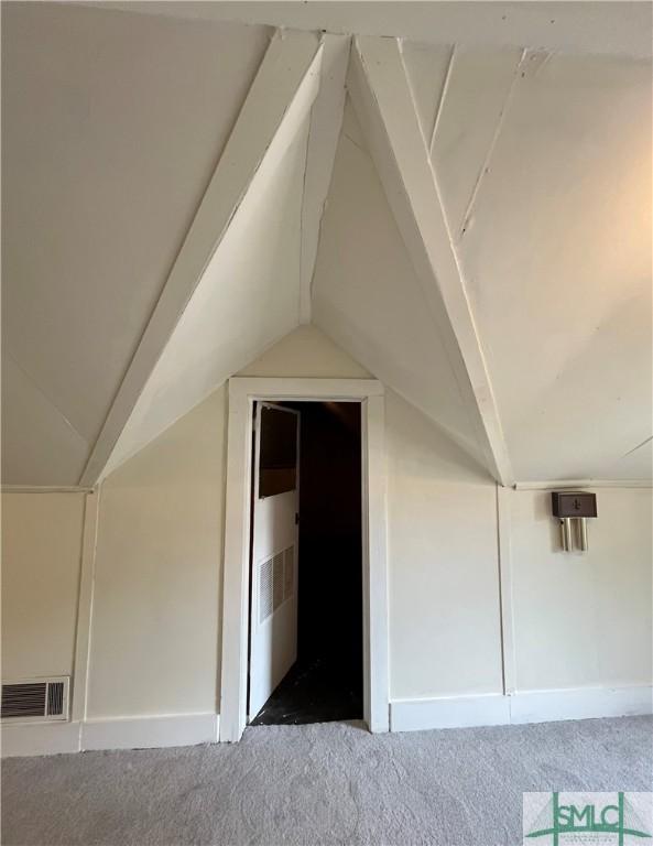 1901 E Anderson St E, Savannah, GA 31404 - bonus room featuring carpet floors, baseboards, lofted ceiling, and visible vents