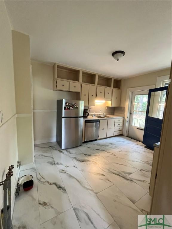 1901 E Anderson St E, Savannah, GA 31404 - kitchen featuring a sink, light countertops, white cabinets, marble finish floor, and stainless steel appliances