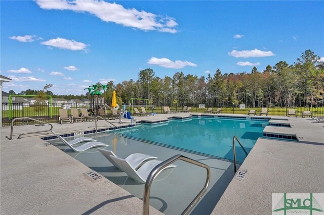 pool featuring a patio and fence