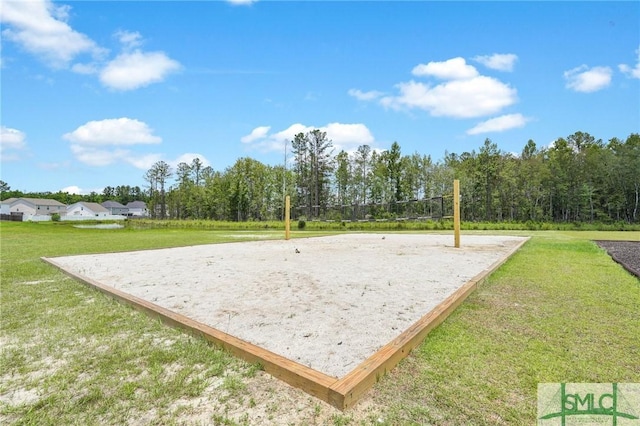 view of home's community featuring a yard and volleyball court