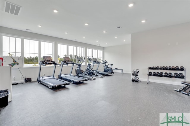 exercise room with visible vents, recessed lighting, baseboards, and plenty of natural light