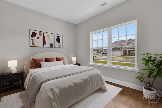 161 Guana Ln, Bloomingdale, GA 31302 - bedroom featuring baseboards and wood finished floors